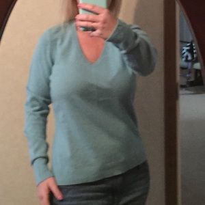 Light to medium blue sweater.